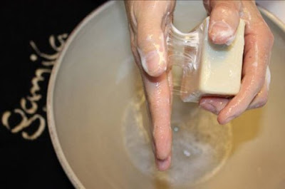 Massage the Cleansing Bar until texture is creamy