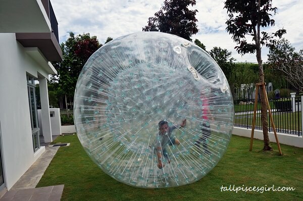 Clumsy Boy playing zorb ball