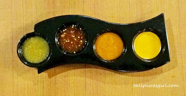 Special dipping sauce (L-R: Lime Chili Sauce, Black Pepper Sauce, Massaman Sauce, Sanoook Sauce)