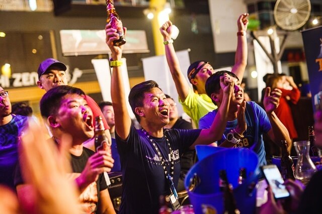 Guests cheering at Tiger Beer's first football viewing party at The Beer Factory, Sunway Giza